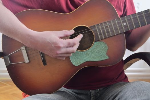 Close-up of men playing acoustic guitar. Musical concept. 