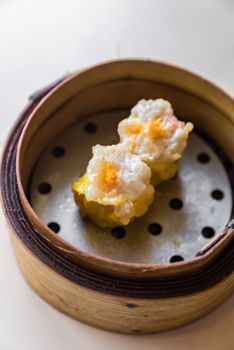 Chinese dim sum in wooden basket