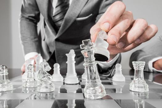 Business man playing chess, business strategy concept