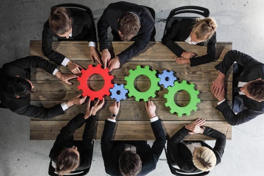 Business people with colorful cogs of business, problem sloution concept