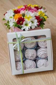 Homemade white zephyr in box with flowers