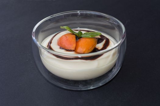 Dessert in glass bowl filled with a fruity pudding.