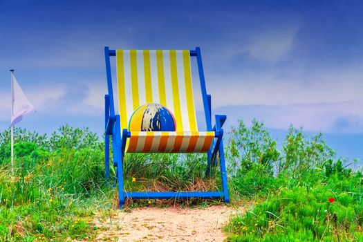 Huge beach chair with colorful ball

           