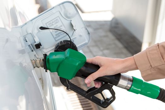 Woman at the gas pump station