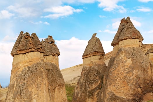 Stone cliffs looks like Fairy houses in Pasabag near Goreme, Cappadocia, Turkey