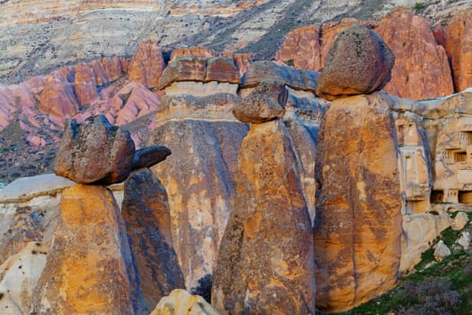 Stone cliffs looks like Fairy houses in Cavusin near Goreme, Cappadocia, Turkey