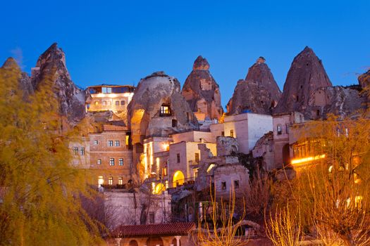 Cylindrical stone cliffs and cave houses in Goreme, Cappadocia, Turkey