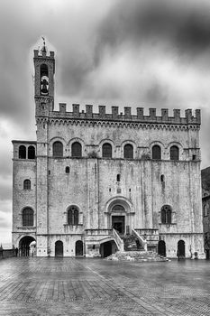 View of Palazzo dei Consoli, a medieval building facing the scenic Piazza Grande in Gubbio, Umbria, central Italy. It is house to the local Civic Museum