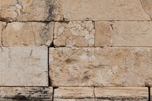 Background of stone wall texture in ruins of ancient Hierapolis near Pamukkale in Turkey