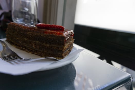 Chocolate cake with strawberries sliced strawberries and topping