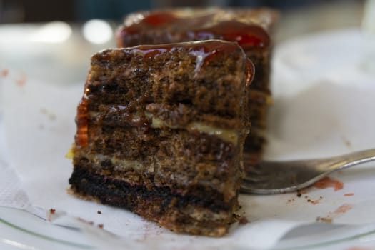 Chocolate cake with strawberries sliced strawberries and topping