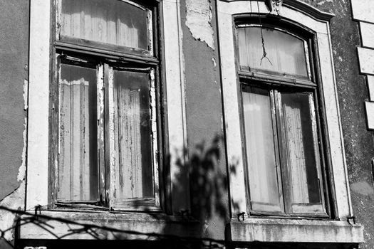 Ruined ancient windows in black and white photo