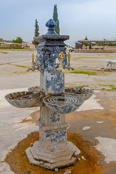 Ancient decorative turkish tap. An old stylized vintage bronze faucet decorated with lion head, Pamukkale, Turkey
