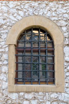 window with a medieval-style grille in the castle