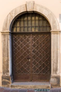 authentic brown door in medieval style close-up