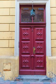 residential building view of the cherry-colored door close-up