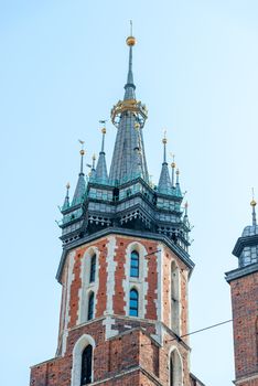 Close-up tower of the Church of the Assumption of the Blessed Virgin Mary in Krakow against the sky