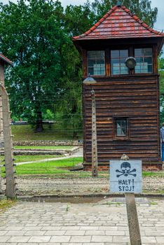 Auschwitz, Poland - August 12, 2017: Auschwitz concentration camp close-up warning sign on the danger line of death