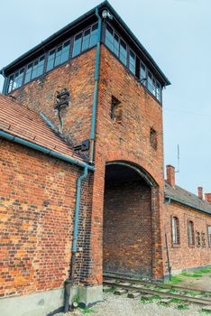 Auschwitz, Poland - August 12, 2017: gates and railroad entering the Auschwitz Birkenau concentration camp