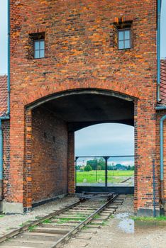 Auschwitz, Poland - August 12, 2017: gates and railroad entering the Auschwitz Birkenau concentration camp