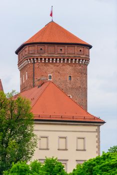 Krakow, Poland - August 13, 2017: Krakow, high brick tower - Wawel Castle on blue sky background