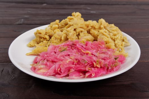 Whole-grain pasta with tofu on a wooden table