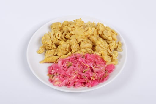 Whole-grain pasta with tofu on a white background