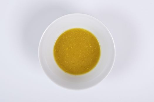 Creamy broccoli soup on a white background