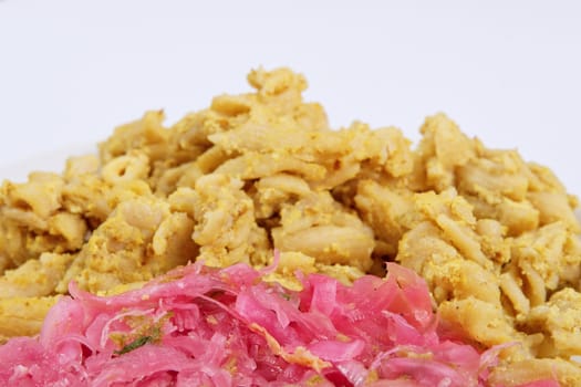 Whole-grain pasta with tofu on a white background