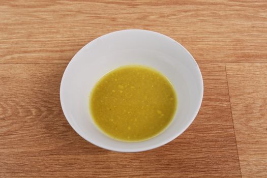 Creamy broccoli soup on a wooden table