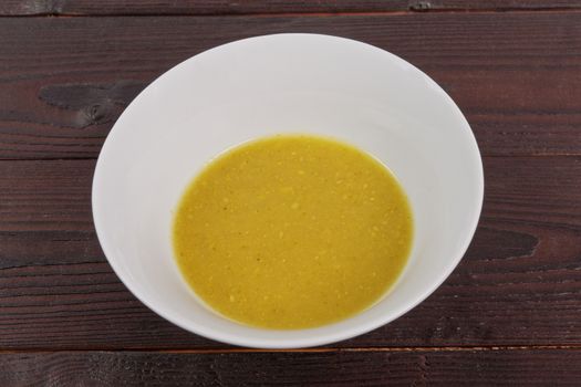 Creamy broccoli soup on a wooden table