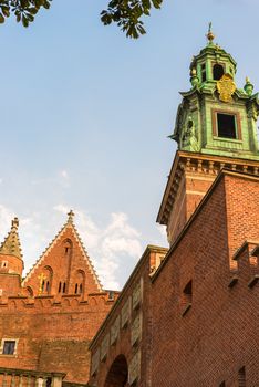 Krakow, Poland - August 14, 2017: high brick tower - Wawel castle against the blue sky