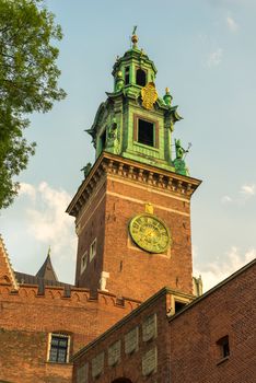 Krakow, Poland - August 14, 2017: high brick tower - Wawel castle in the suumer day against the blue sky