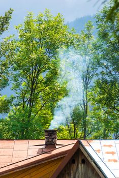 The chimney, from which comes the smoke in the center of the frame