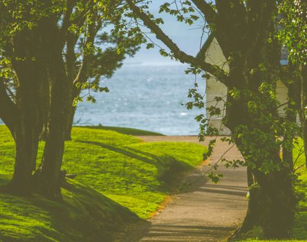 Conceptual Summer Image Of A Path Down To A House By The Sea In The UK