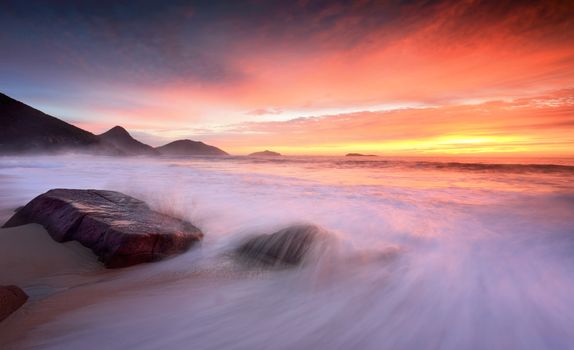 Beautiful sunrise at the beach where waves washing onto the beach create splash and motion
Port Stephens