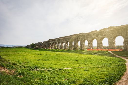 The Parco degli Acquedotti at sunset. Parco degli Acquedotti is an archeological public park in Rome, part of the Appian Way Regional Park, with monumental ruins of roman aqueducts.