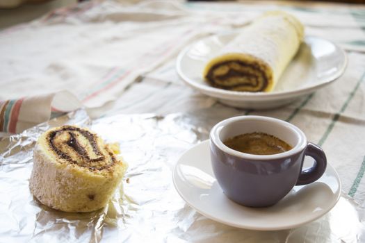 breakfast with Swiss roll with chocolate filling and espresso