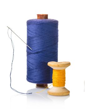 coils with colorful thread on white isolated background