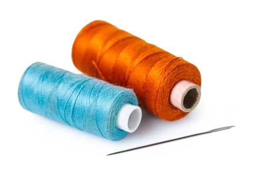 coils with colorful thread on white isolated background