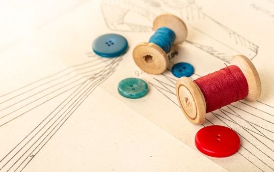 coils of colored threads on a background of paper pattern