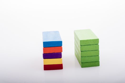 Colorful Domino Blocks in a line on a white background