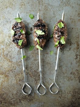 close up of rustic greek middle eastern lamb kofta