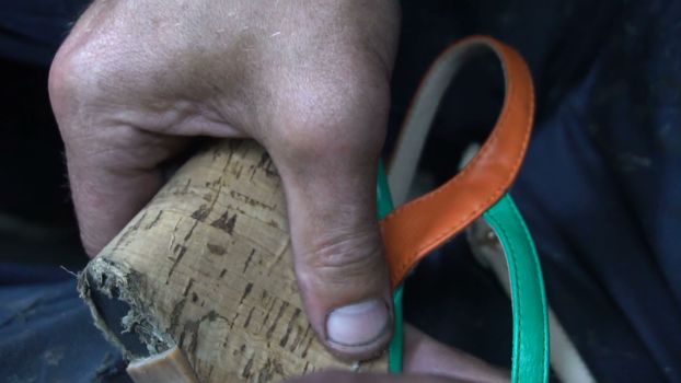 the shoemaker at work.The process of repairing shoes in workshop.
