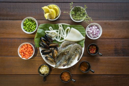 Overhead shot of Raw seafood on plate, healthy food, prawn, clam squid.