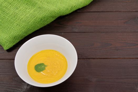 Miso vegetable soup with vegetables on a wooden table