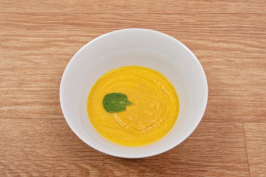 Miso vegetable soup with vegetables on a wooden table