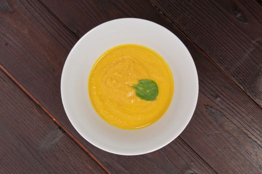 Miso vegetable soup with vegetables on a wooden table