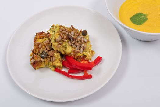 Azuki with vegetables on steam on a white background