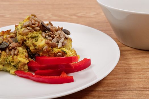 Azuki with vegetables on steam on a wooden table